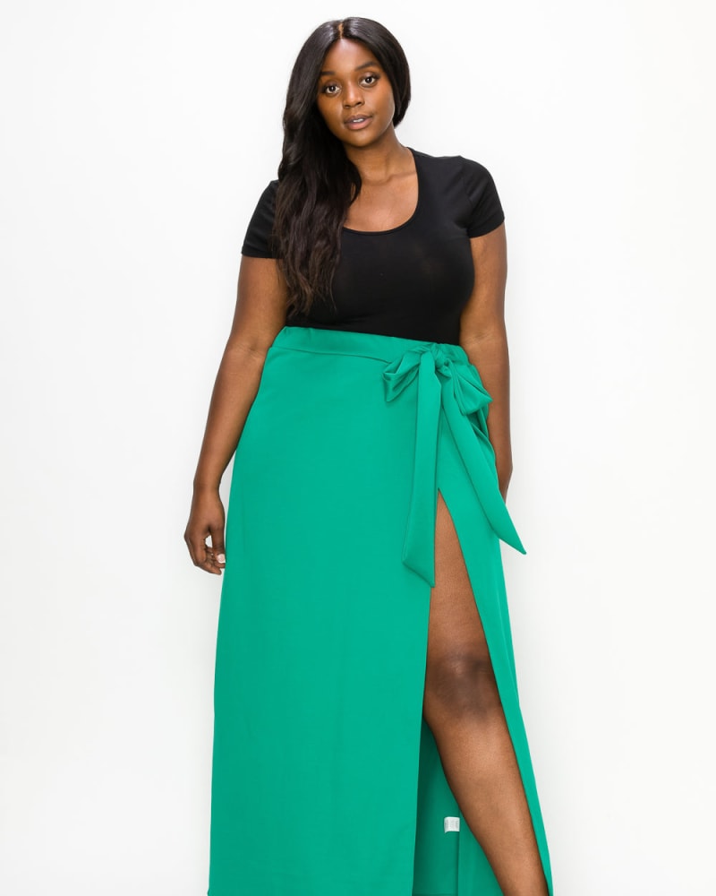 Front of a model wearing a size 2X Kelsey Wrap Maxi Skirt in Emerald by L I V D. | dia_product_style_image_id:241623